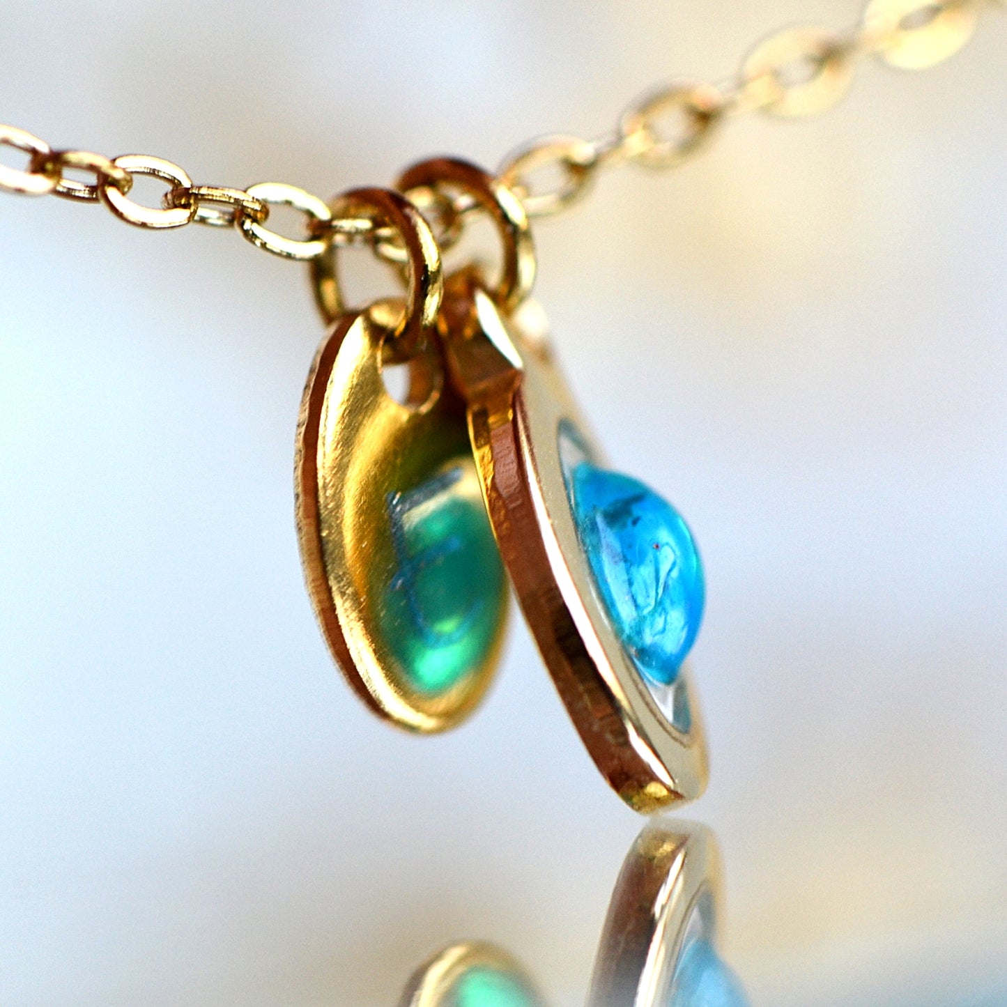 Necklace with opal and initial in gold setting